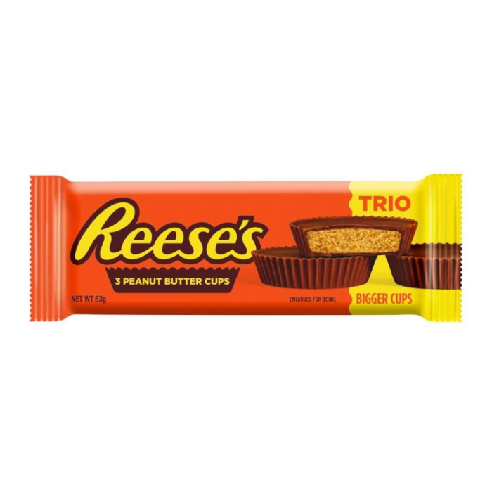 Three Reese's Peanut Butter Cups unwrapped side by side, showing the ridged milk chocolate shell and creamy peanut butter filling