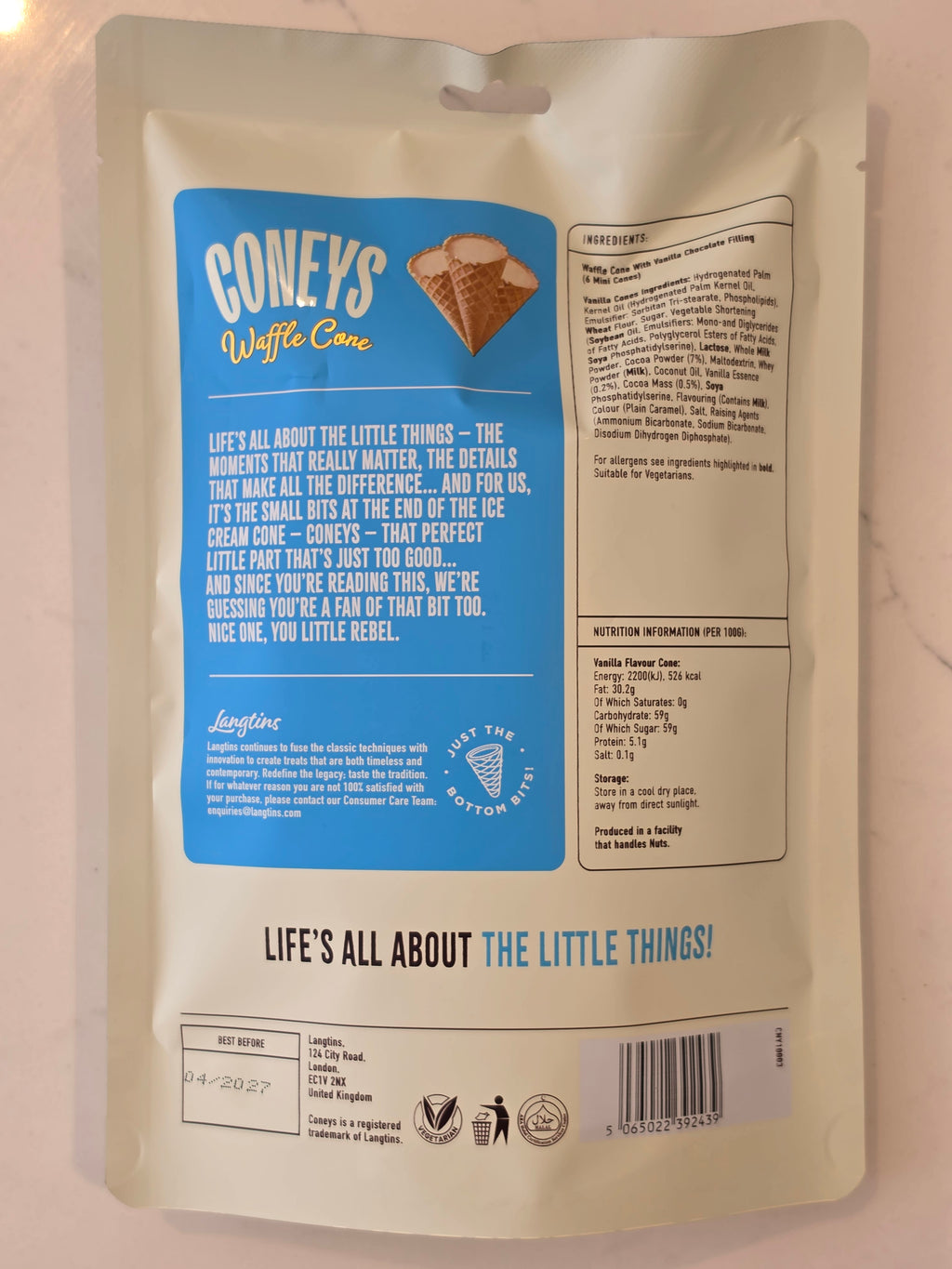 Back of a Cone's Waffle Cone pouch on a light marble-like surface, showing printed text, a blue label panel, and a barcode.